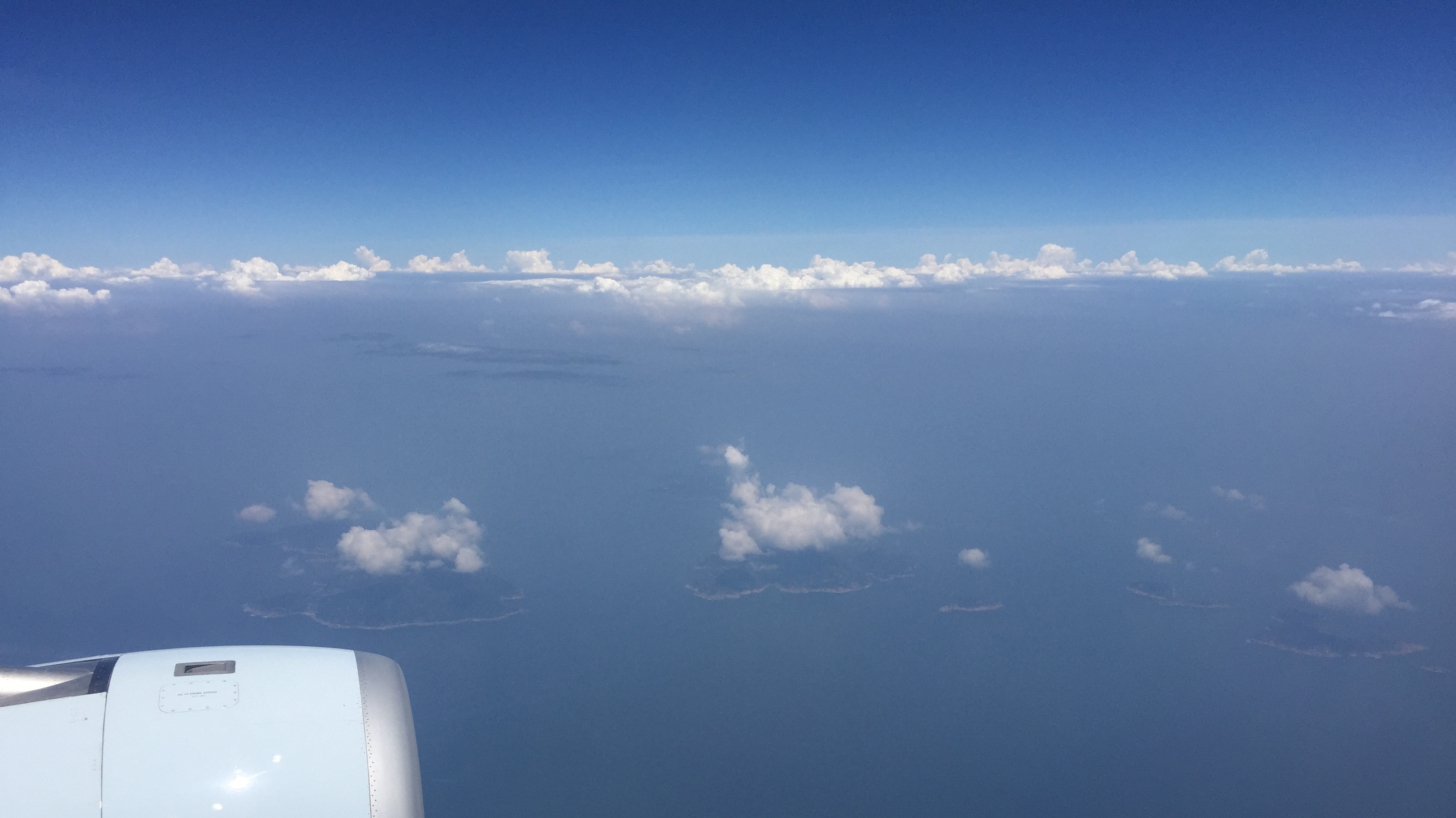 Clouds over several small islands from an aircraft